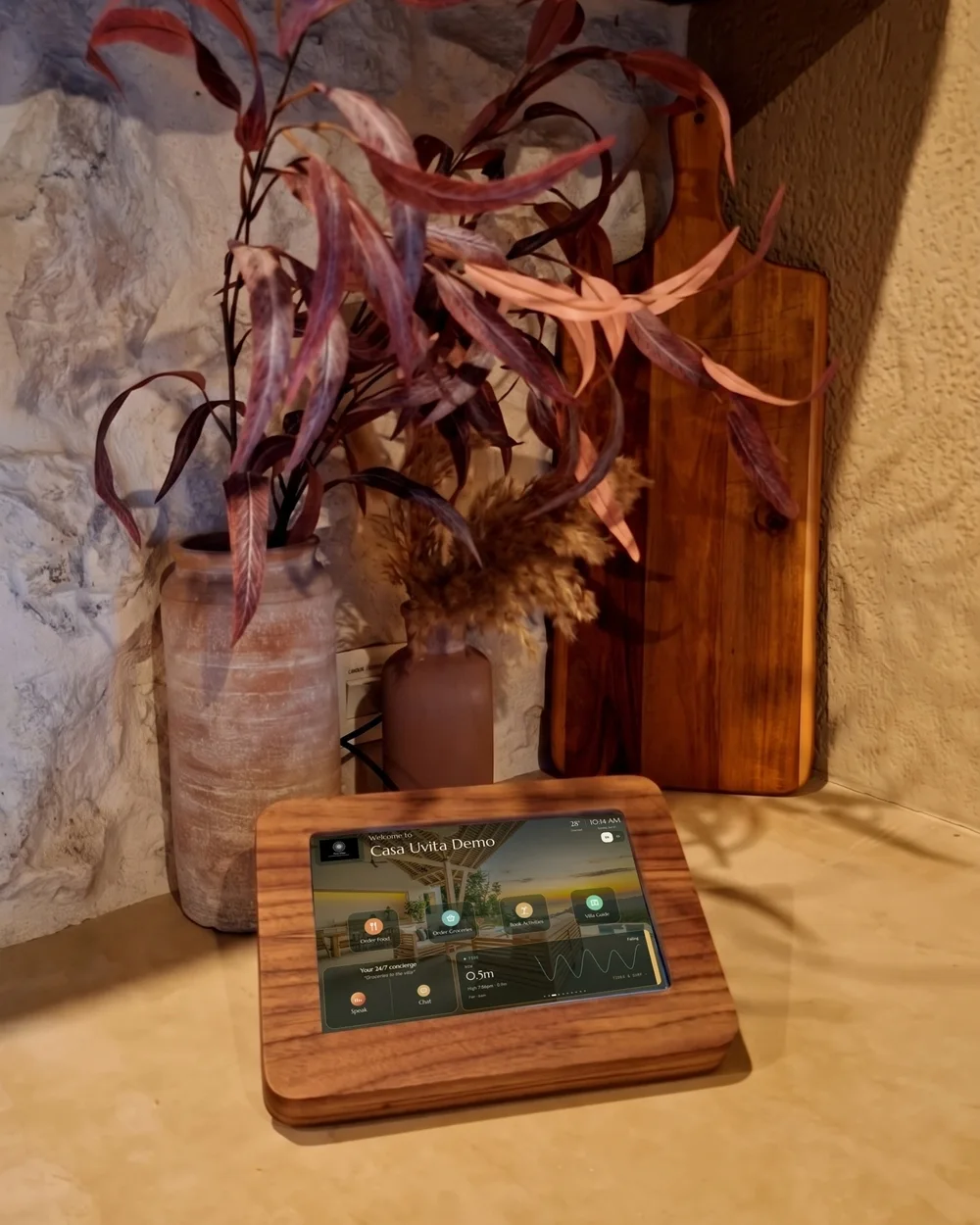 chucho tablet in its wooden stand on a stone kitchen counter in a Costa Ballena home