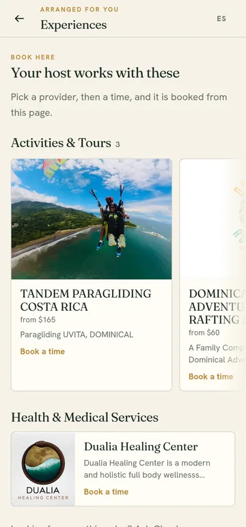The experiences screen: tandem paragliding from $165, an adventure rafting trip from $60, and a wellness centre, each with a Book a time link.